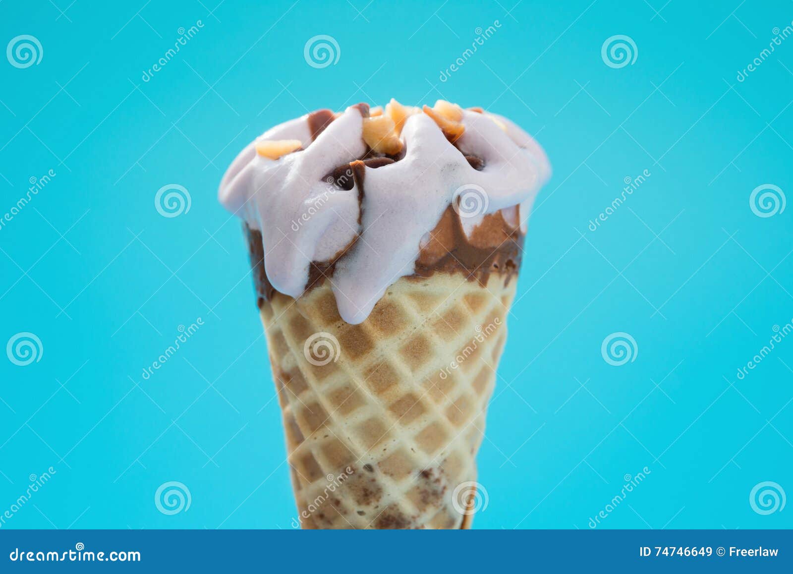 Peanut Flavor Ice Cream Cone Melting on Blue Backgrond Stock Image