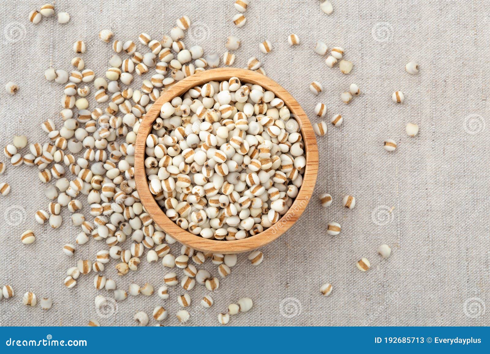 pearl barley in wooden bowl on table