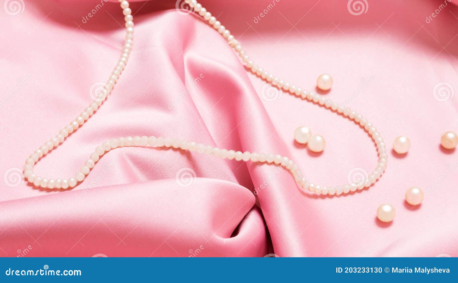 Premium Photo | Beautiful pearl necklace on a background of pink rose  petals ideal for greeting cards