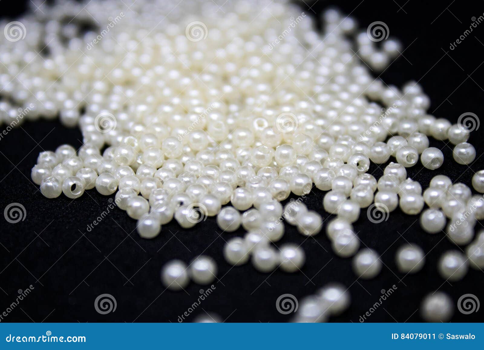 Pearl Beads Spilled on a Black Background Stock Image - Image of pearl