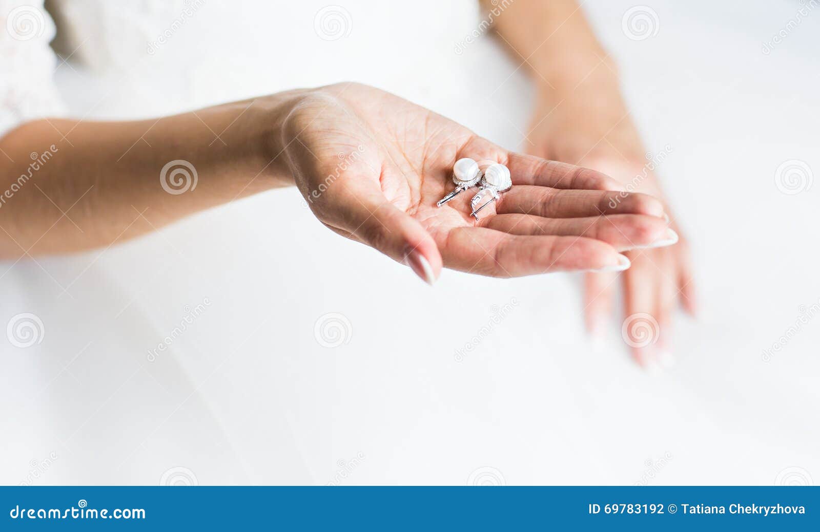 Pearl earring in hands stock photo. Image of happiness 69783192