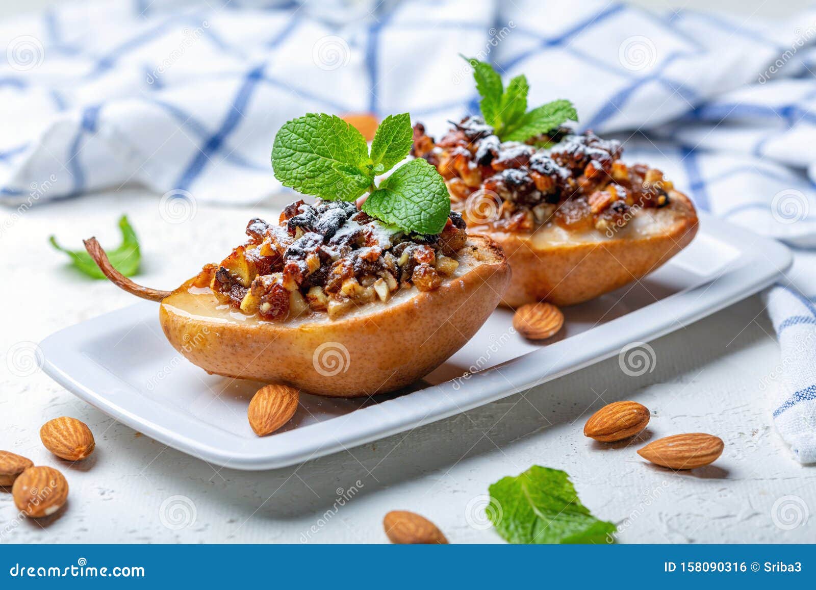 Pears Baked with Raisins, Nuts, Honey and Mint Stock Photo - Image of ...