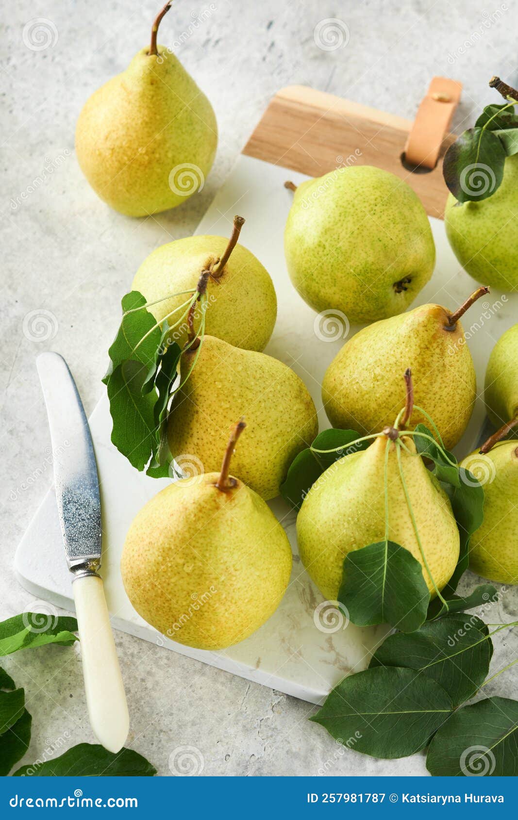 Pears. Fresh Sweet Organic Pears with Leaves on Stand or Plate on