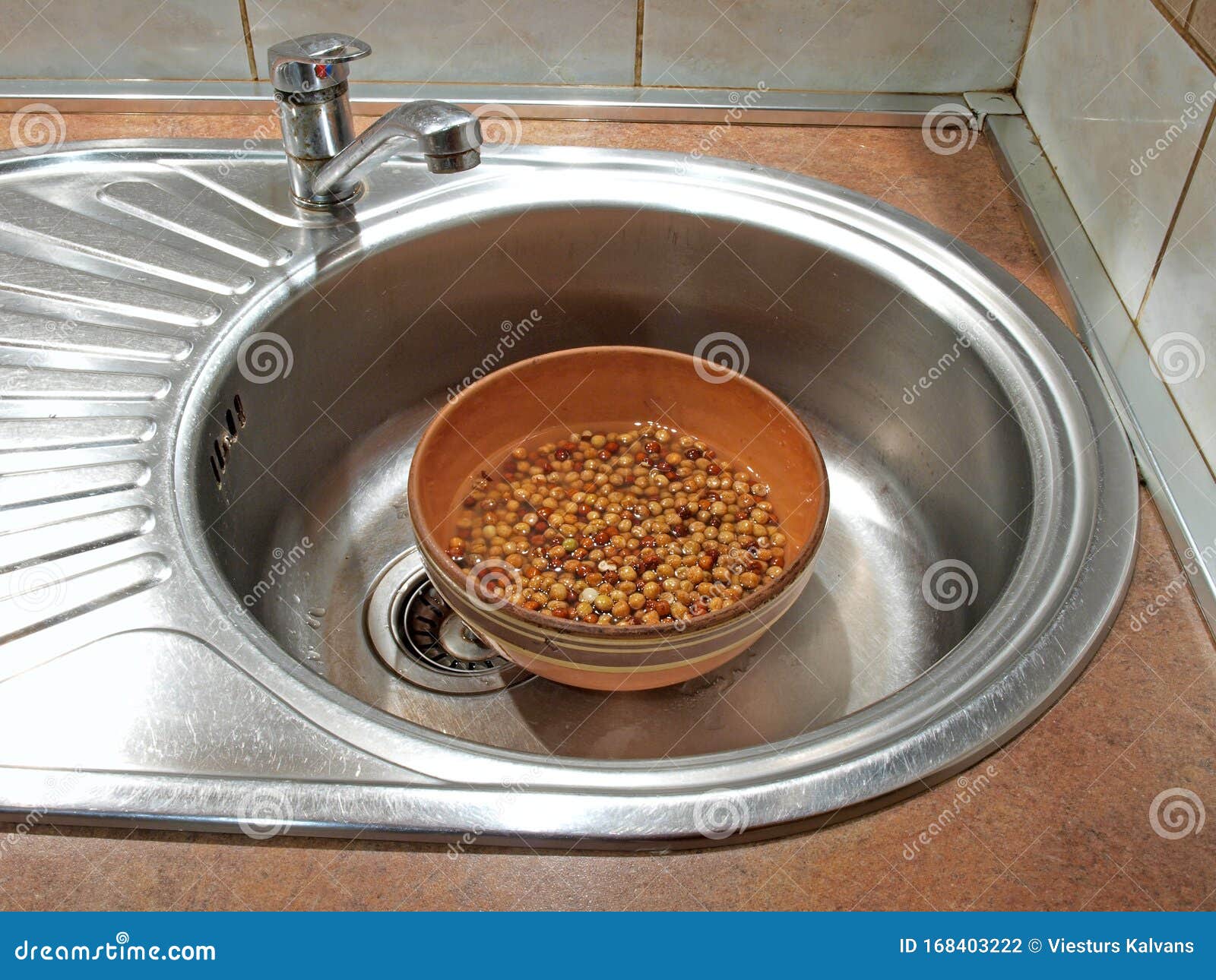 Soaking peas stock photo. Image of sink, water, brown 168403222