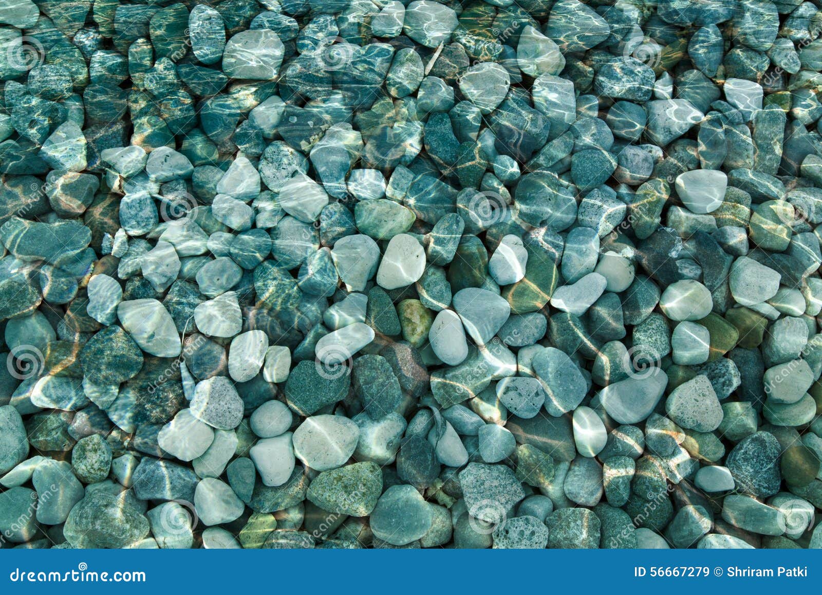 pebbles and rocks under water background