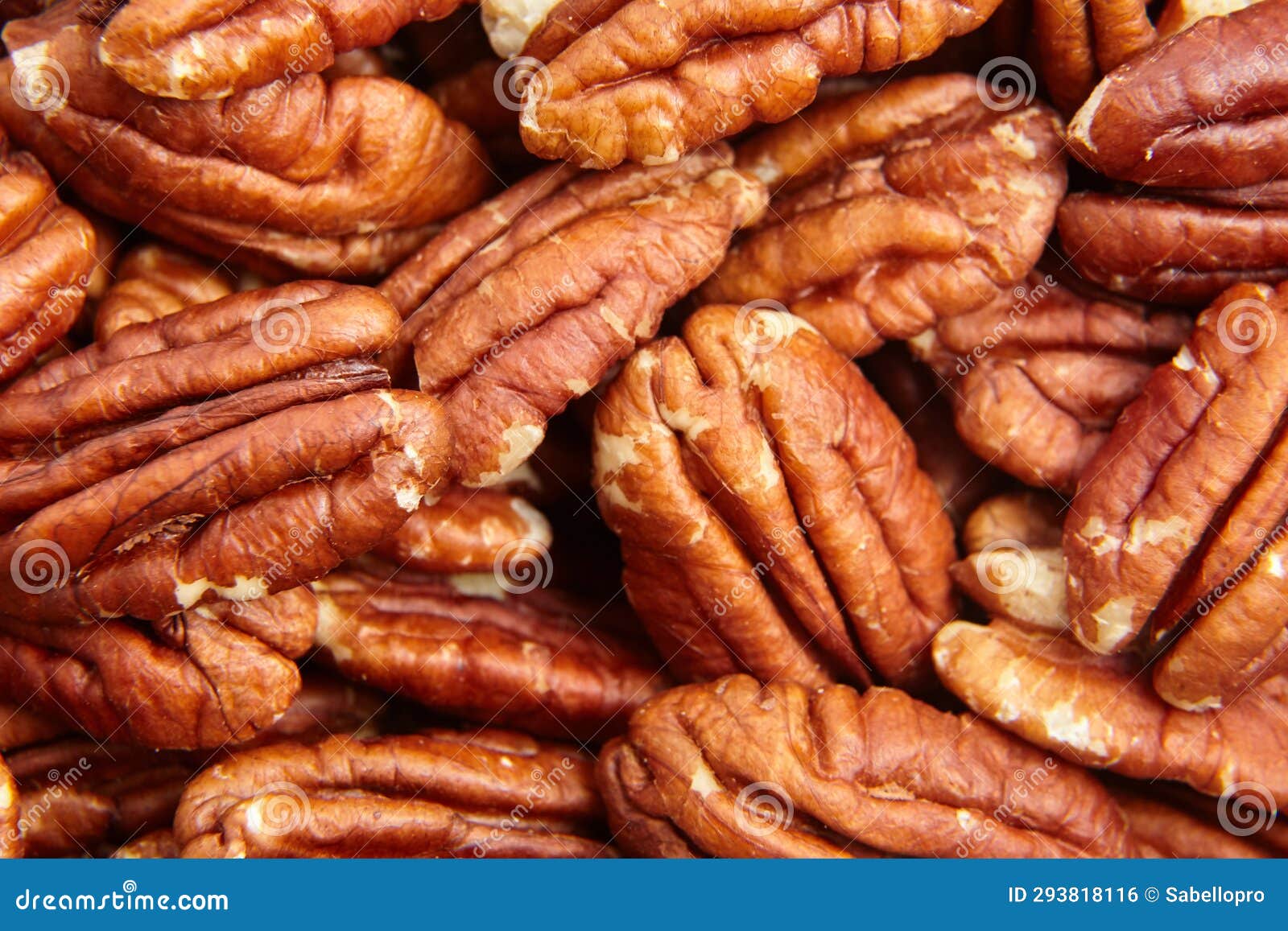 Pecan Nuts Kernel Texture Background Closeup. Heap of Peeled Pecan