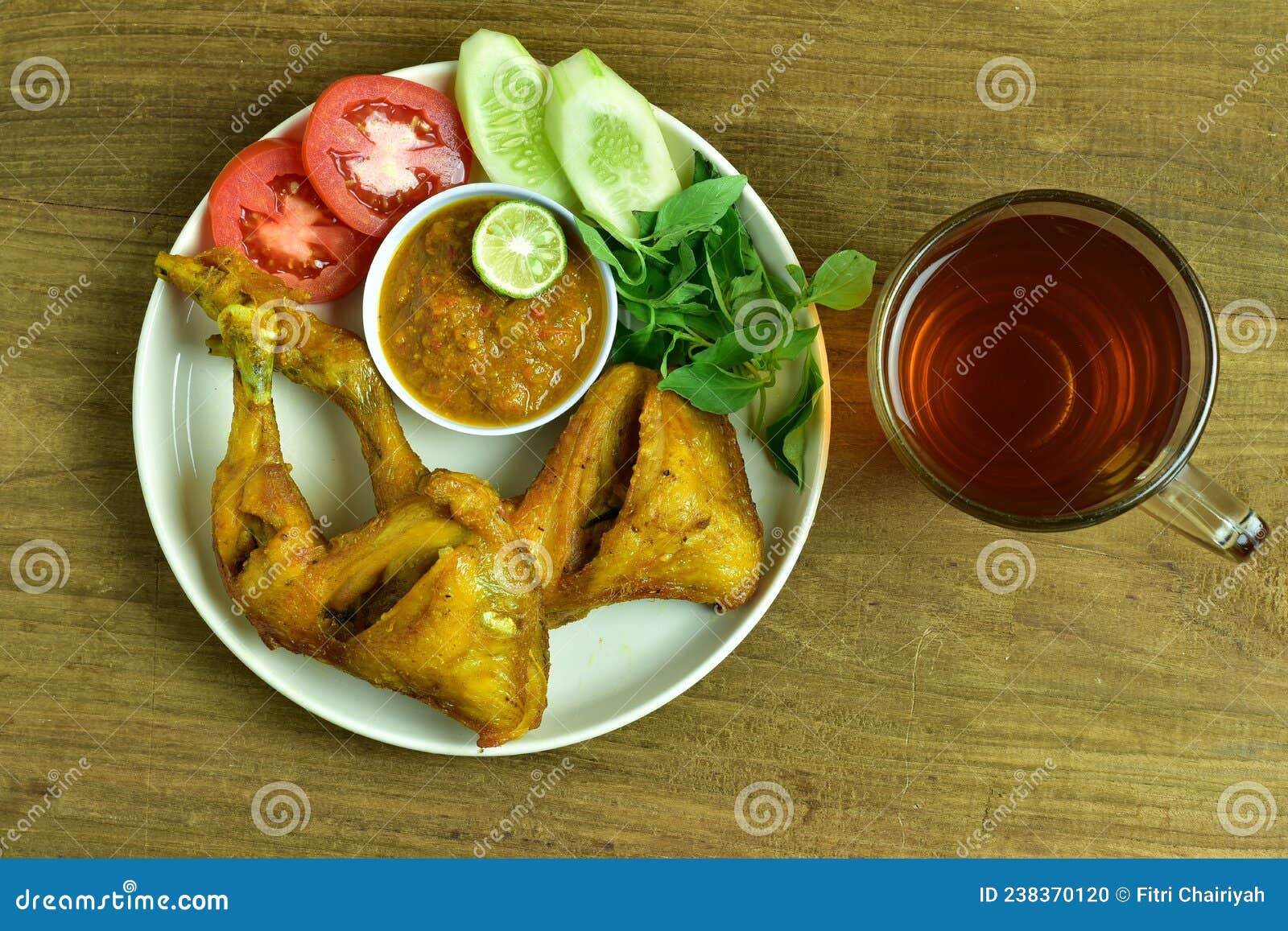 Pecel Ayam Fried Chicken With Sambal And Fresh Vegetables Stock Photo