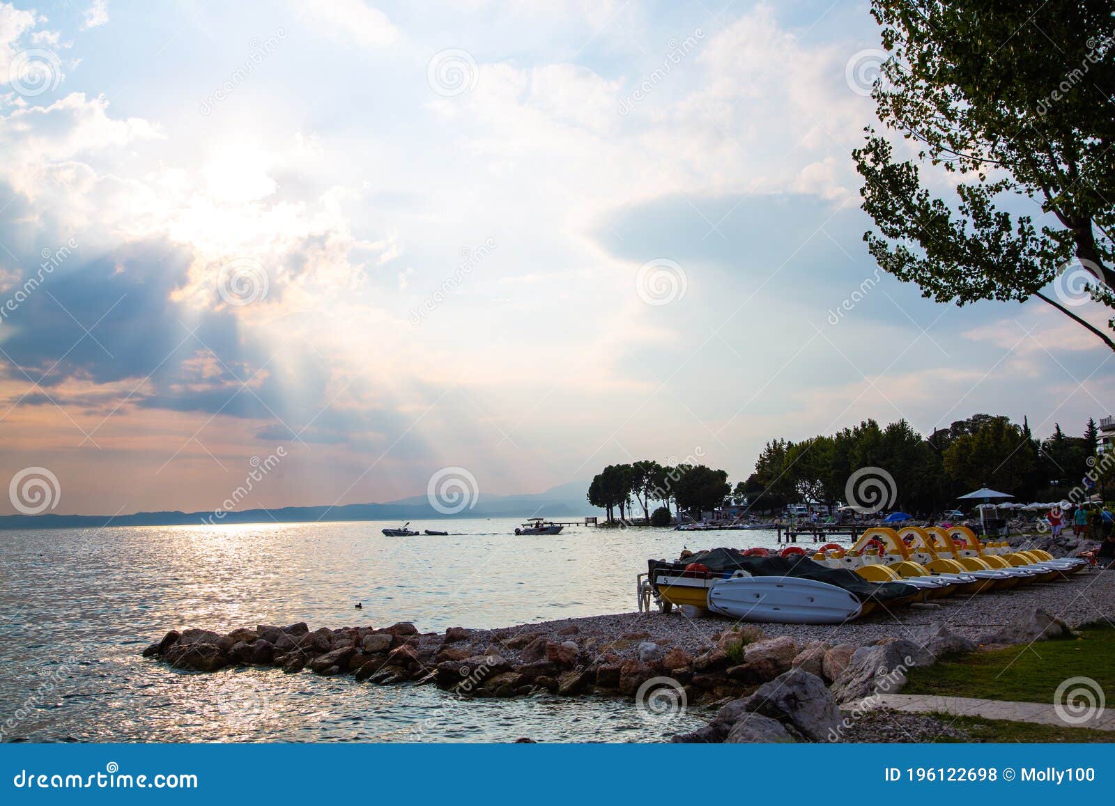 Pedal boats on Lake Garda stock photo. Image of holiday 196122698