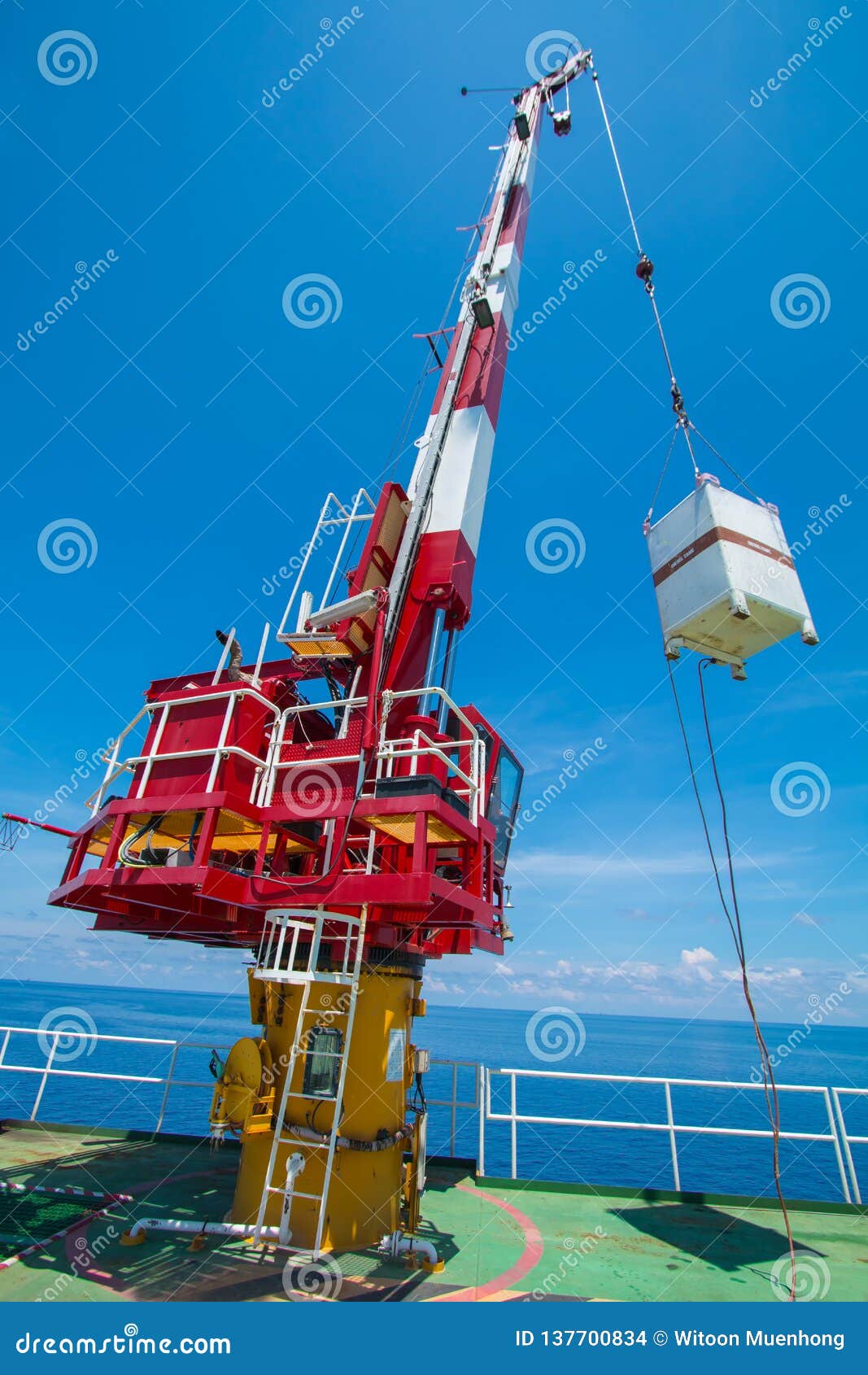 Pedestal Crane, Crane Operator during Operate Crane with Blue Sky Stock