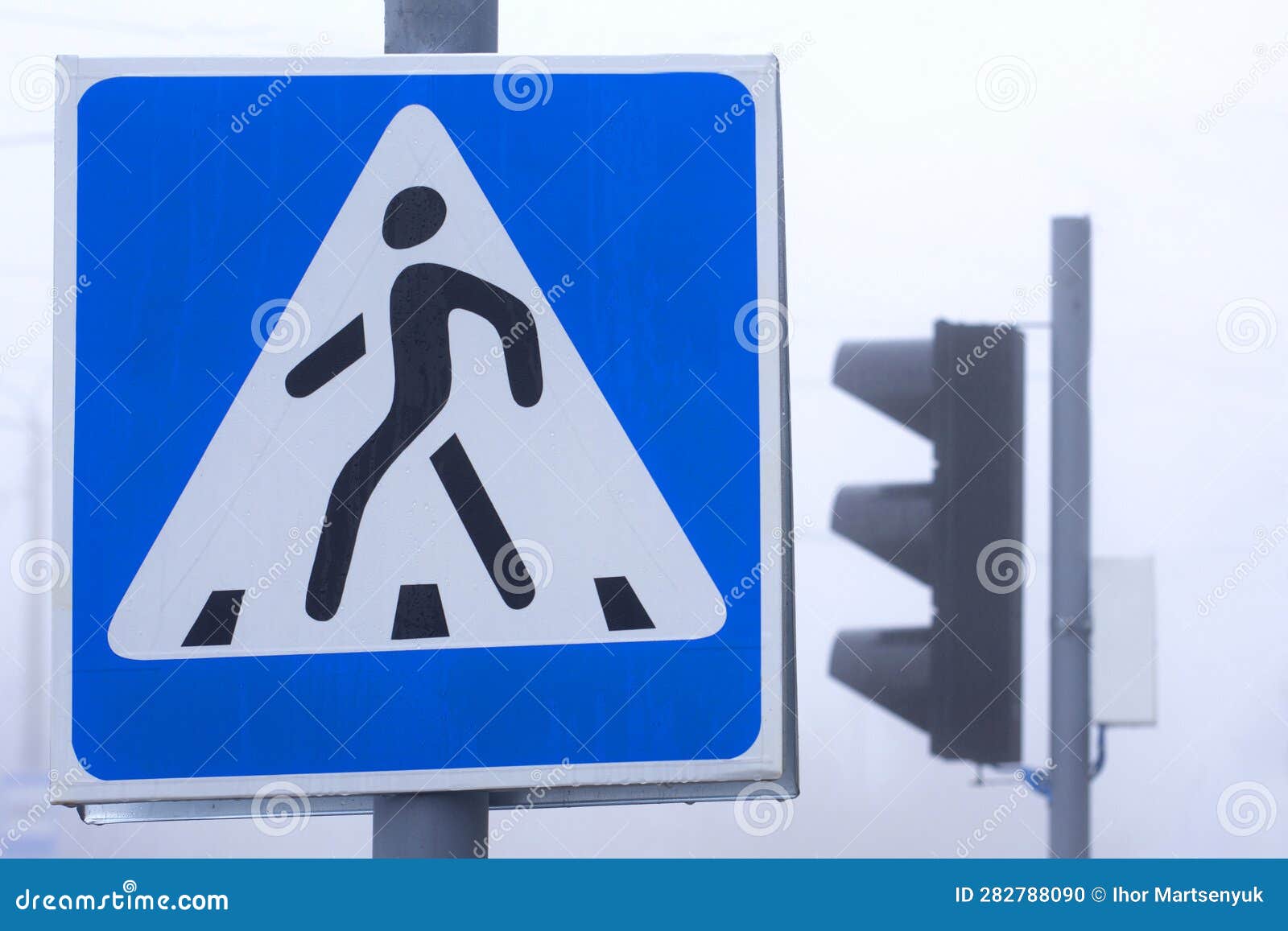 Pedestrian Crossing Sign On The Road Traffic Lights And Other Road pedestrian-crossing-sign-on-the-road-traffic-lights-and-other-road