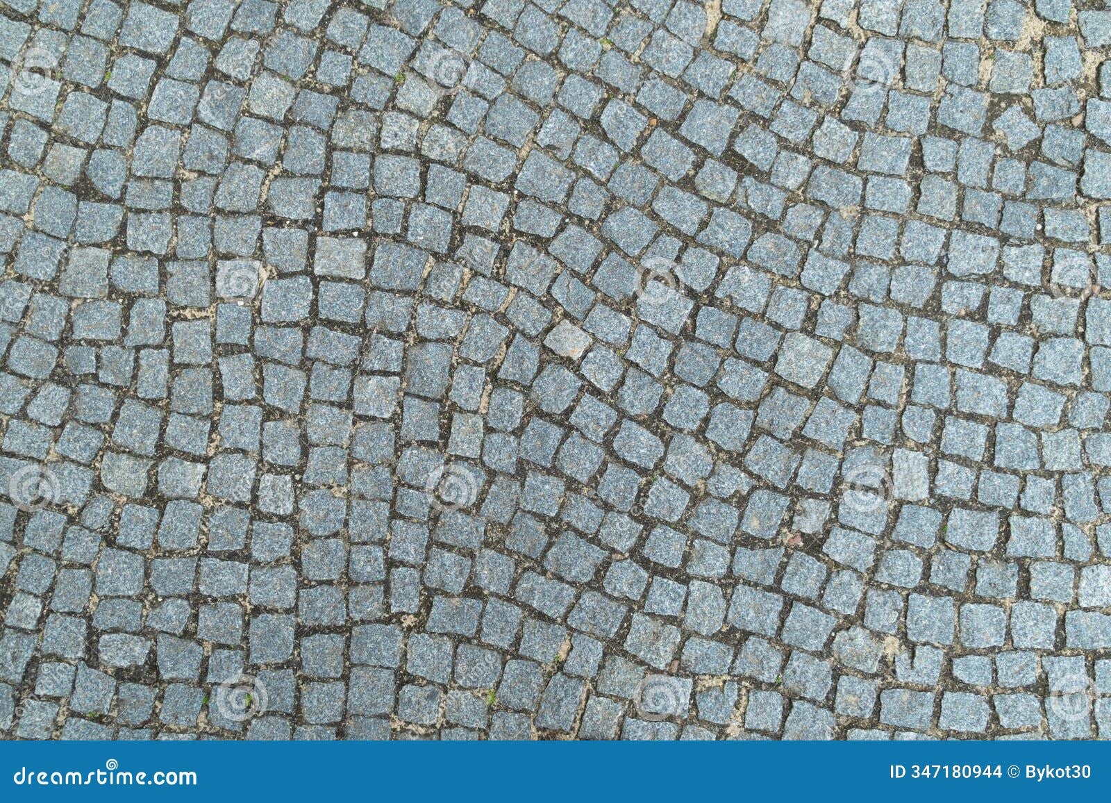 pedestrian path with small square stones. background