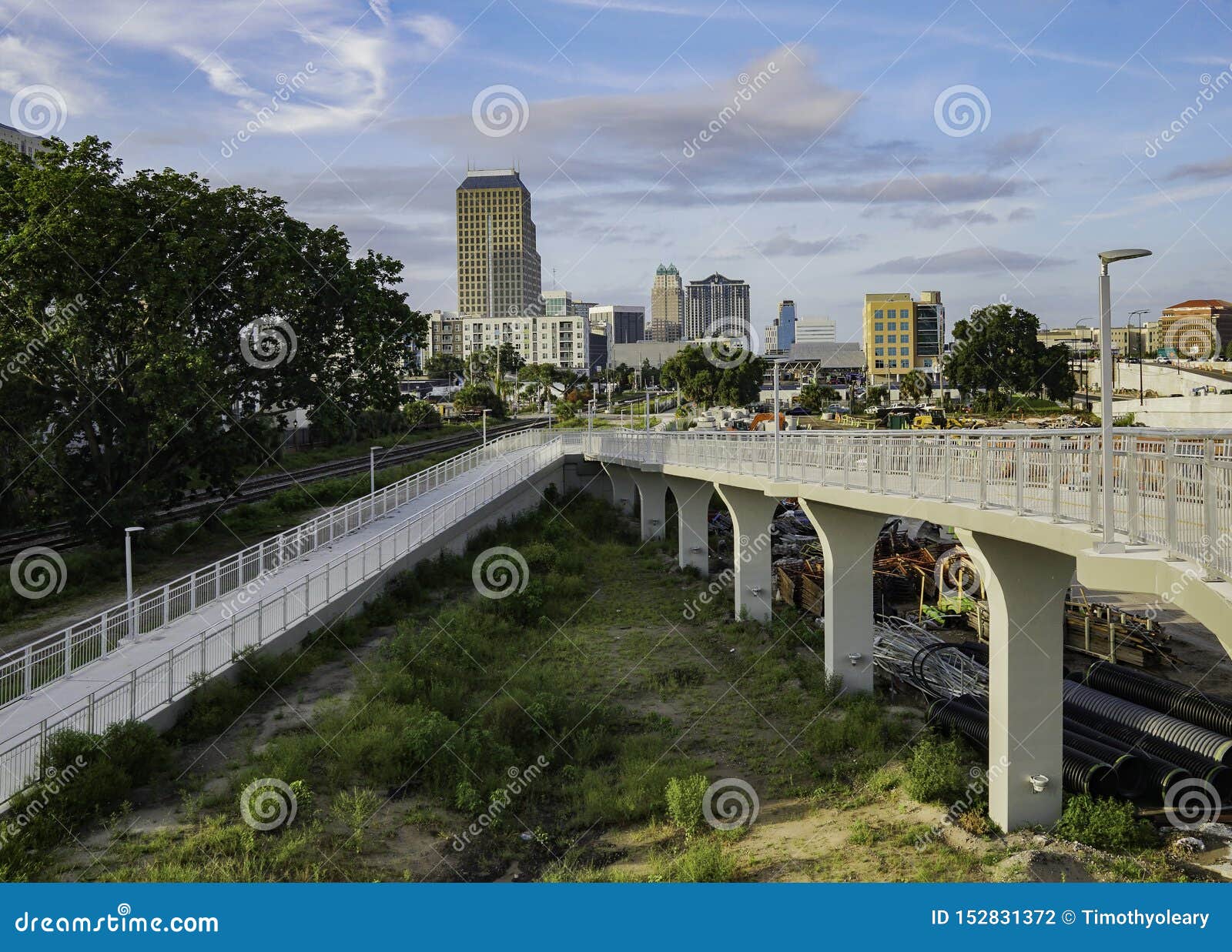 walkway over a busy streeet during the early morning commute at orlando florida