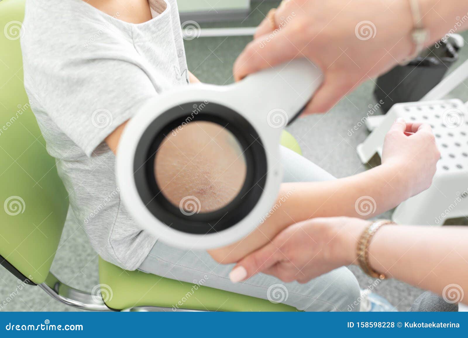 Pediatric Dermatologist Examines A Girl With A ...