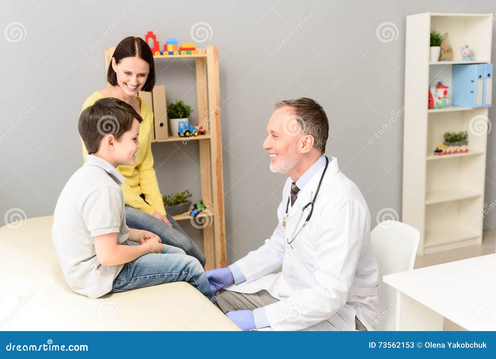 pediatrician doctor examining child