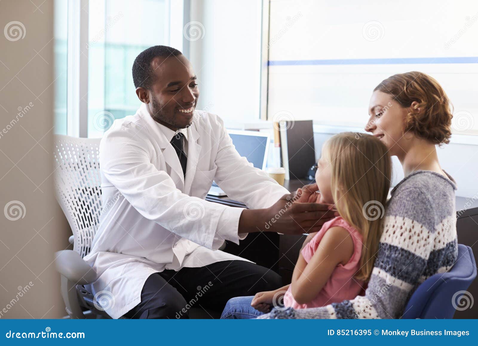 pediatrician examining child in hospital