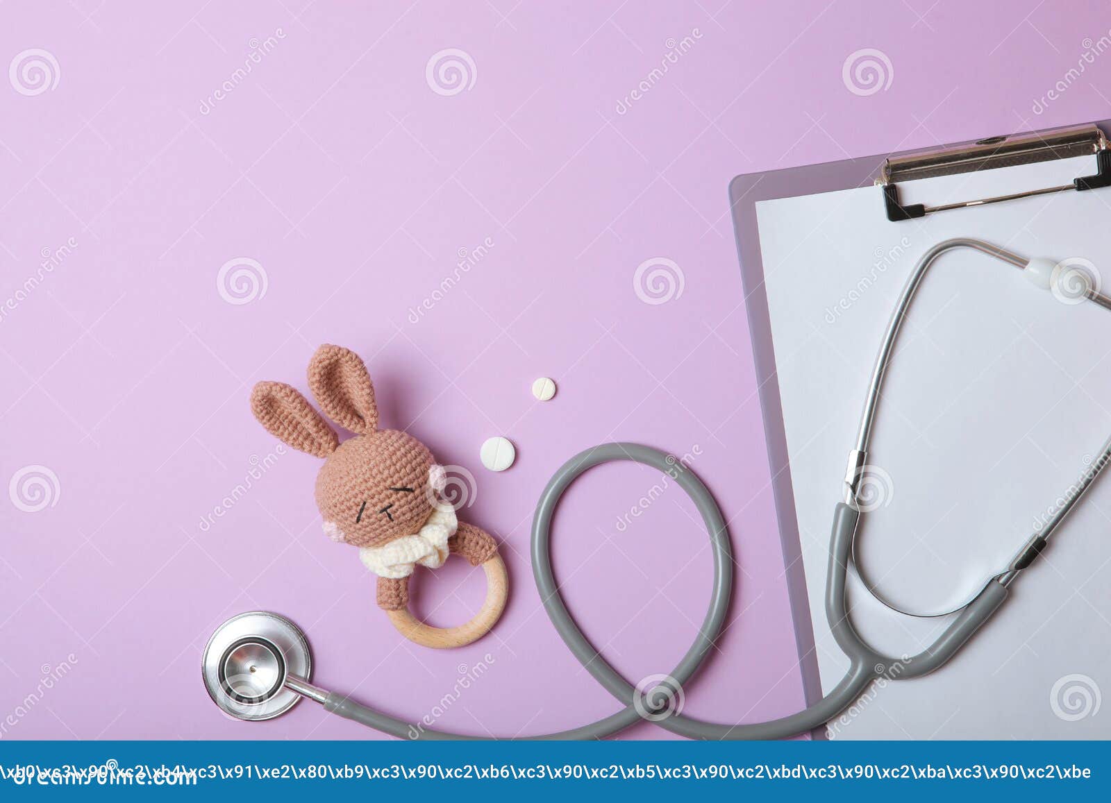 pediatrics concept. stethoscope and toy on a light background