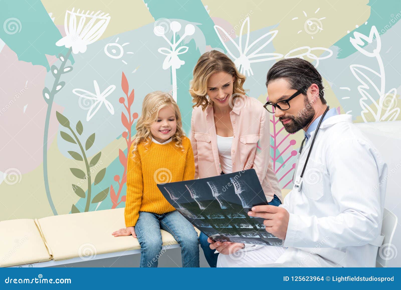 pediatrist showing x-ray