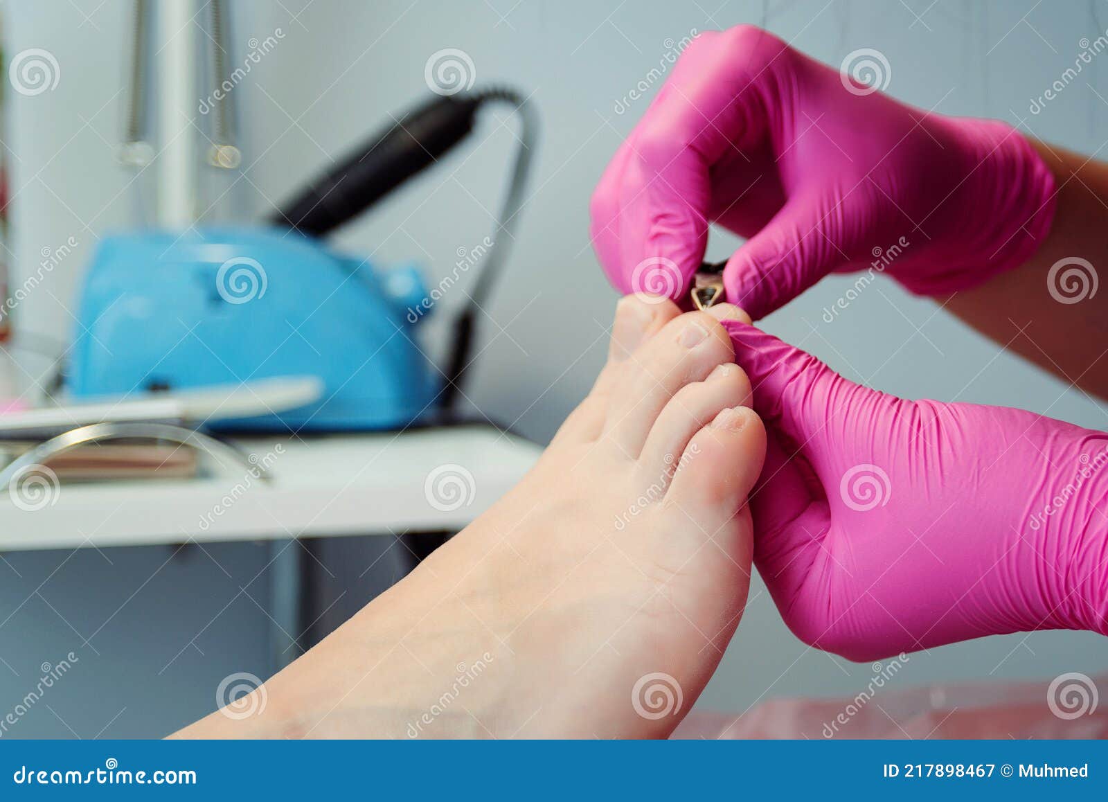 The Pedicure Master Wipes The Client`s Feet With A Towel While Making ...