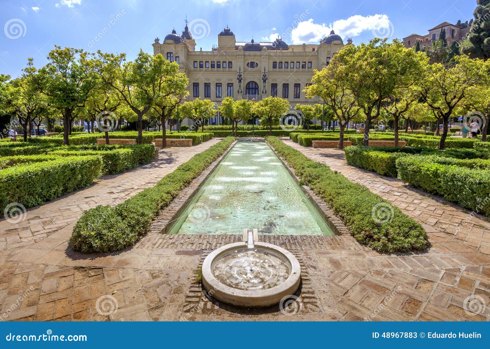 pedro luis alonso gardens and the town hall building in malaga,