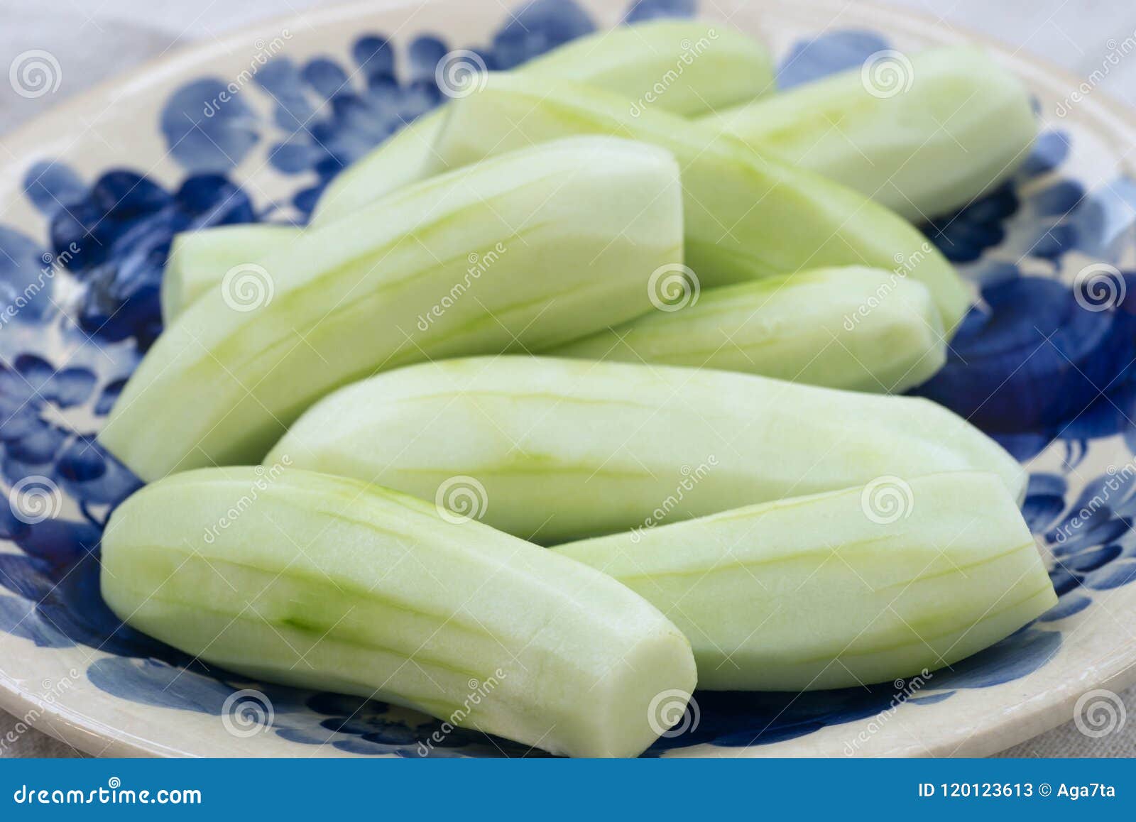 Peeled cucumbers on plate stock image. Image of appetizer 120123613