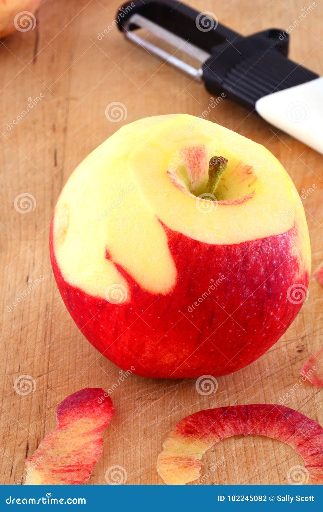 Peeling an apple stock photo. Image of eating, nutritious 102245082