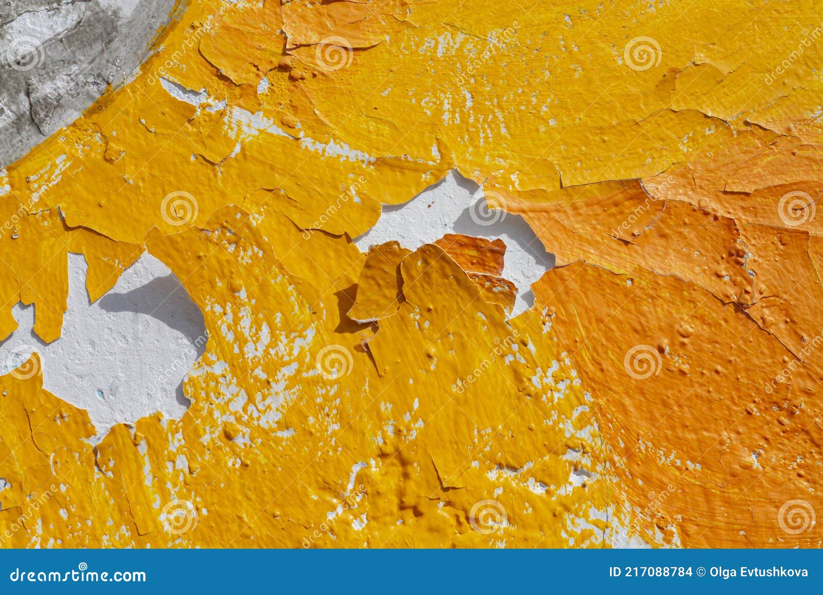 Peeling Yellow Paint from the Wall in the Cracks Falls Off in Layers