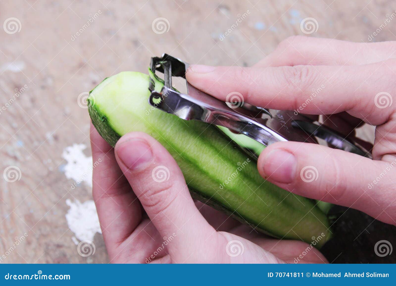 Premium Photo  Peeling fresh green zucchini with peeler. process