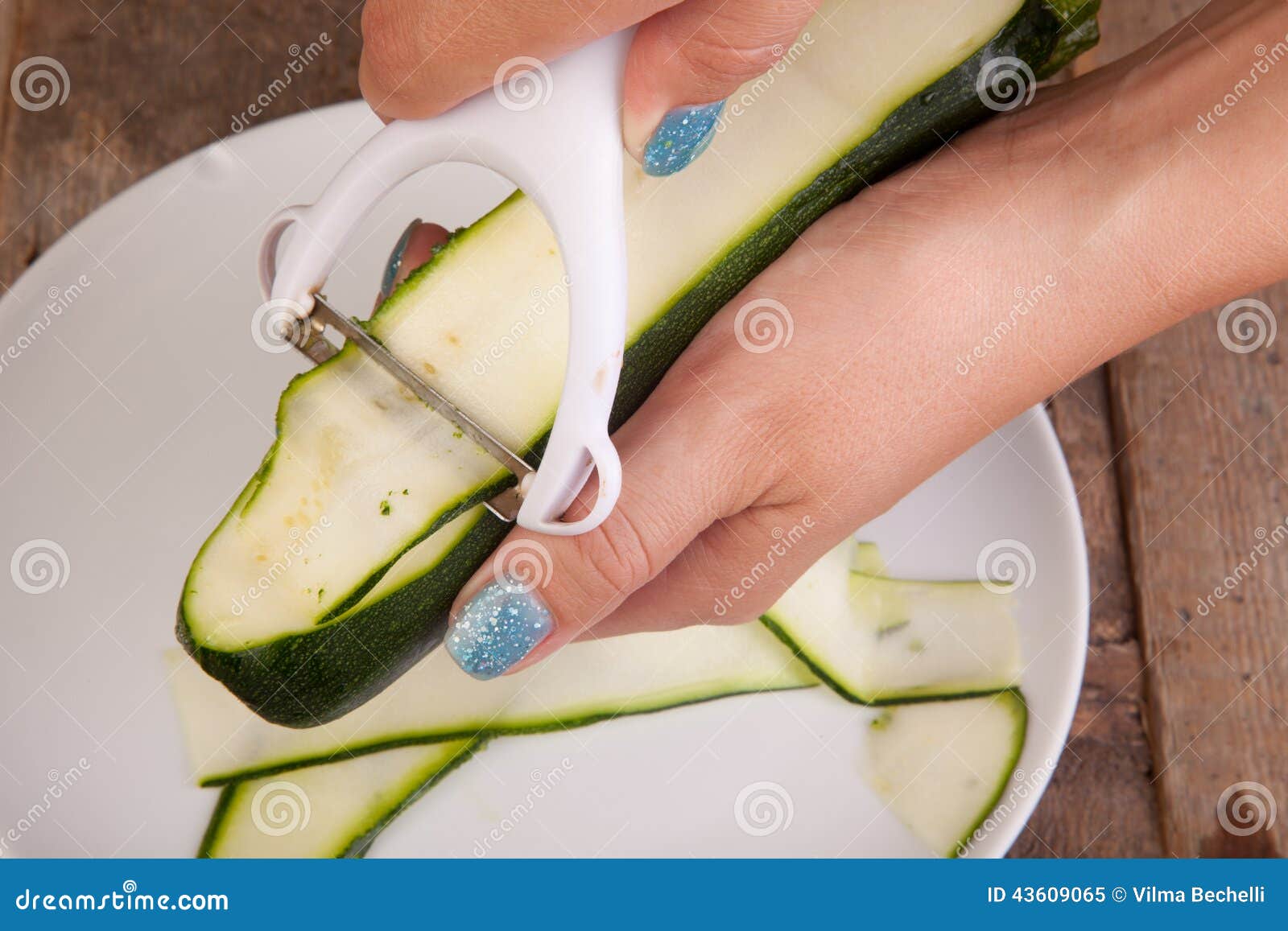Peeling zucchini stock image. Image of kitchen, preparation 43609065