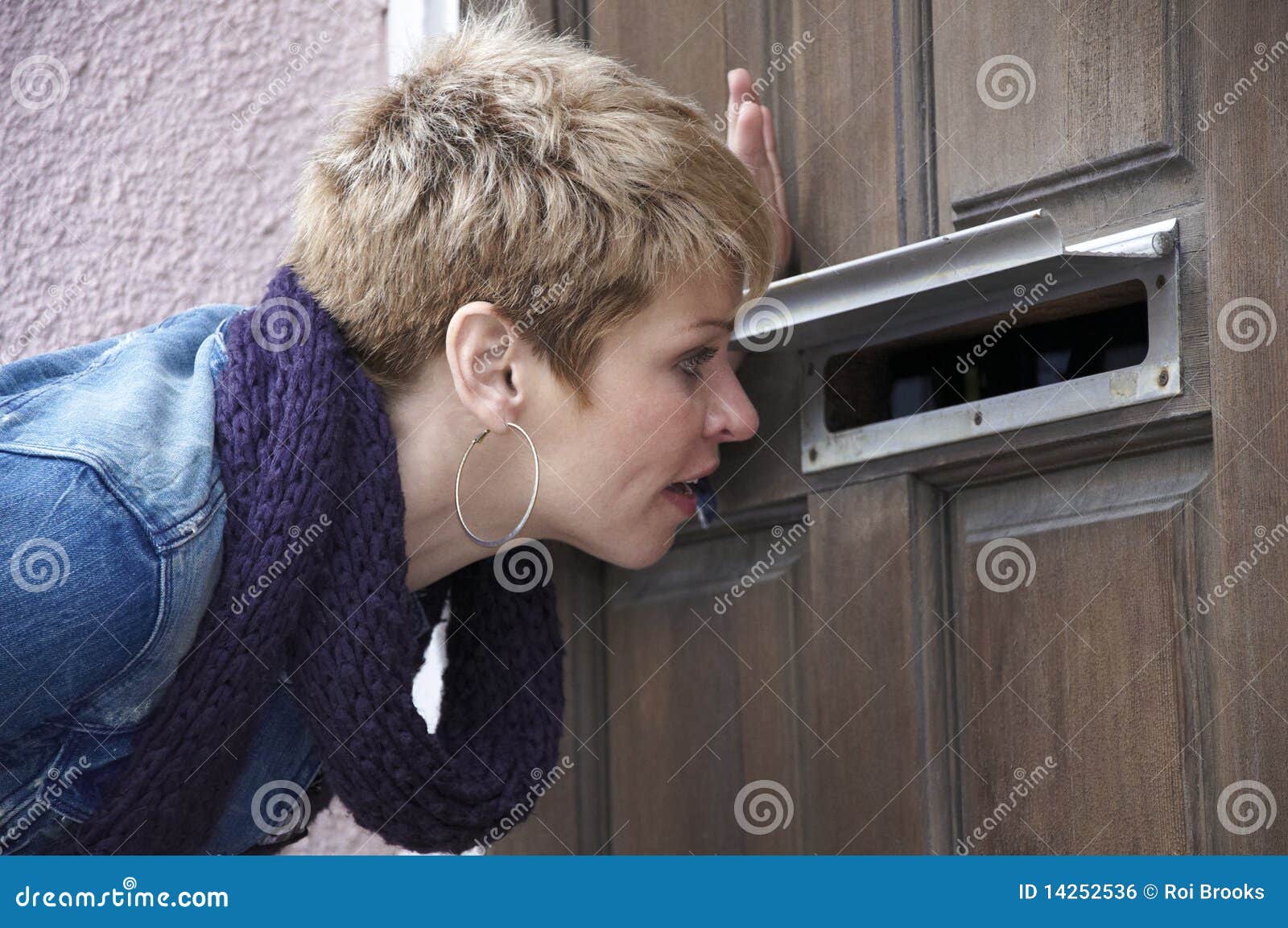 Peeping through the Mail Slot Stock Photo - Image of face, denim: 14252536