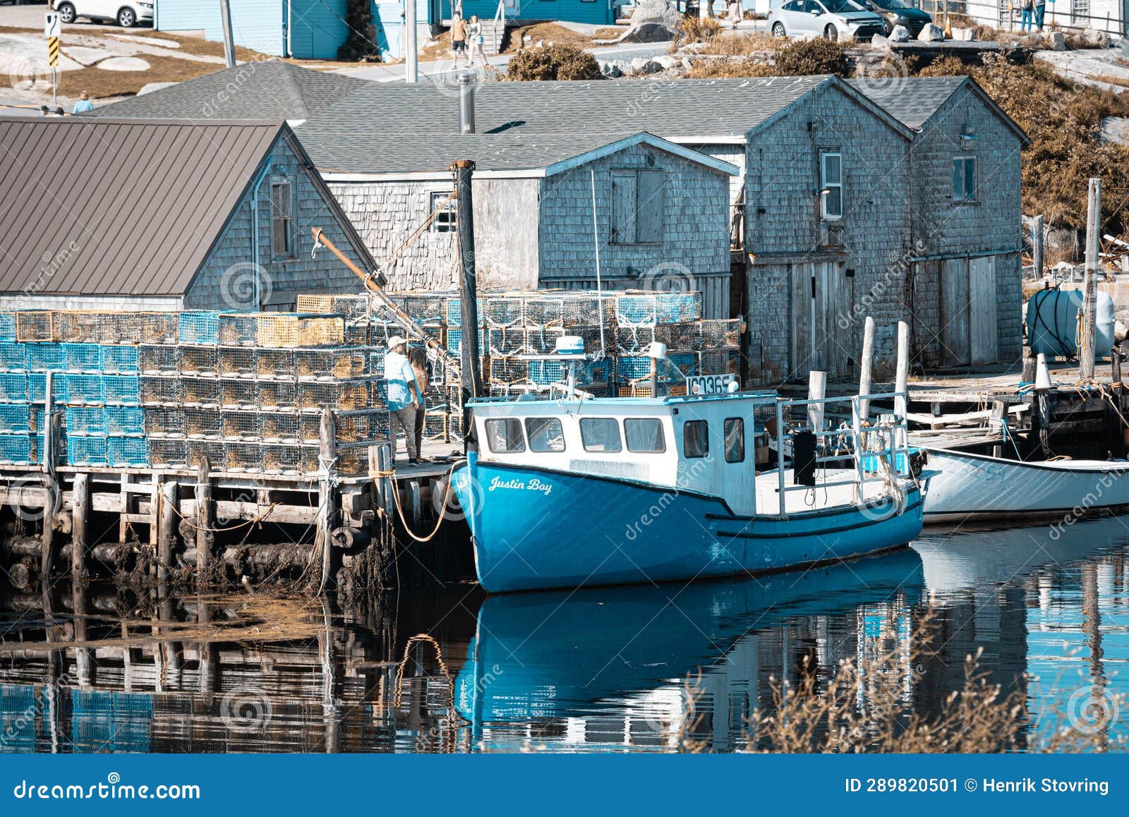 Peggy S Cove Harbor - Fishing Boat and Storage Houses Stock Image