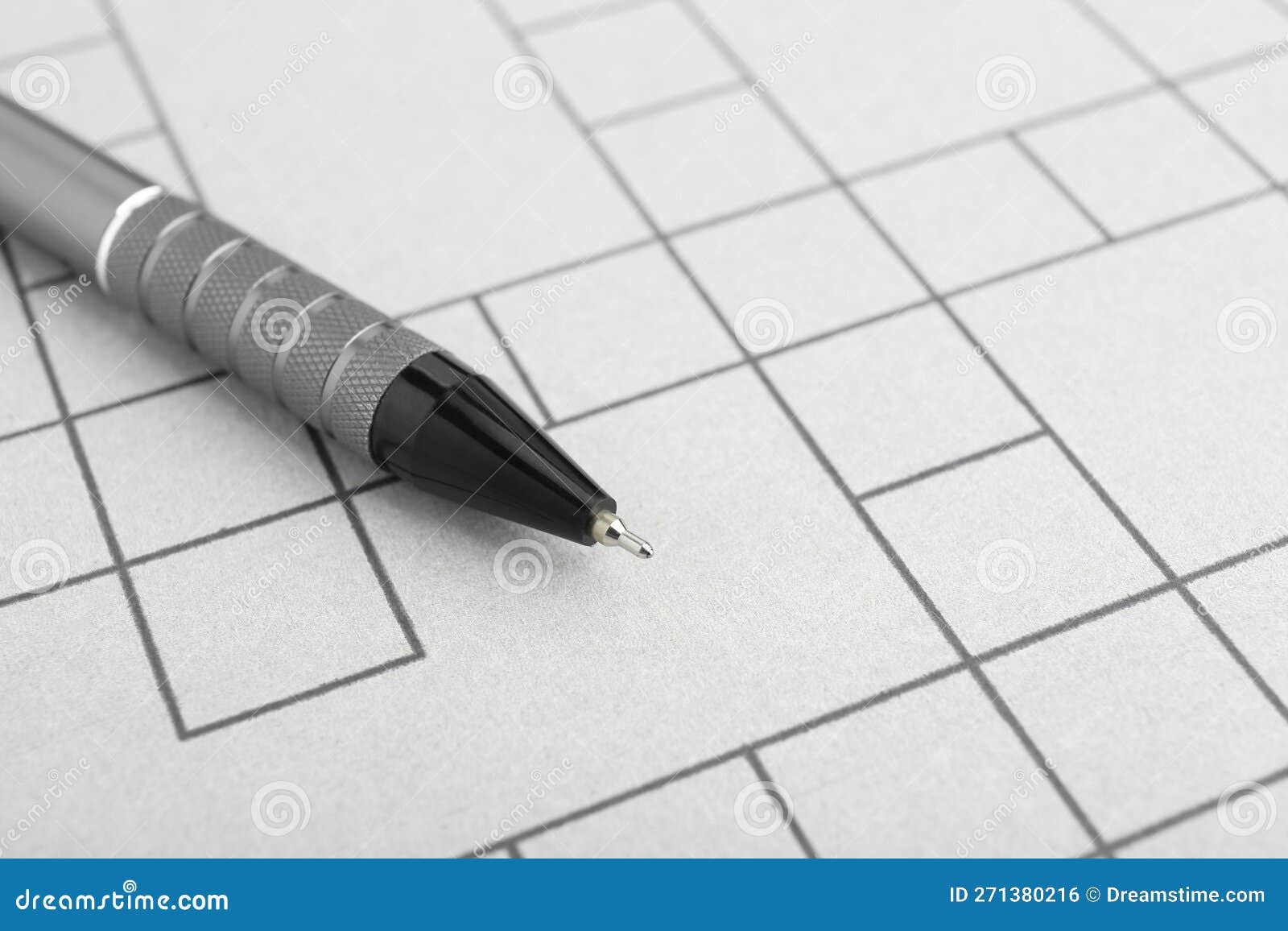 Pen on Blank Crossword, Closeup. Space for Text Stock Photo Image of