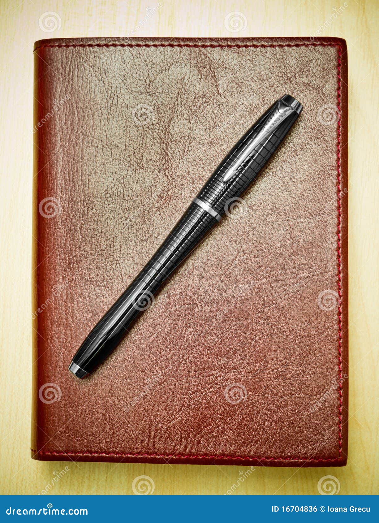 Pen on leather journal stock photo. Image of journal 16704836