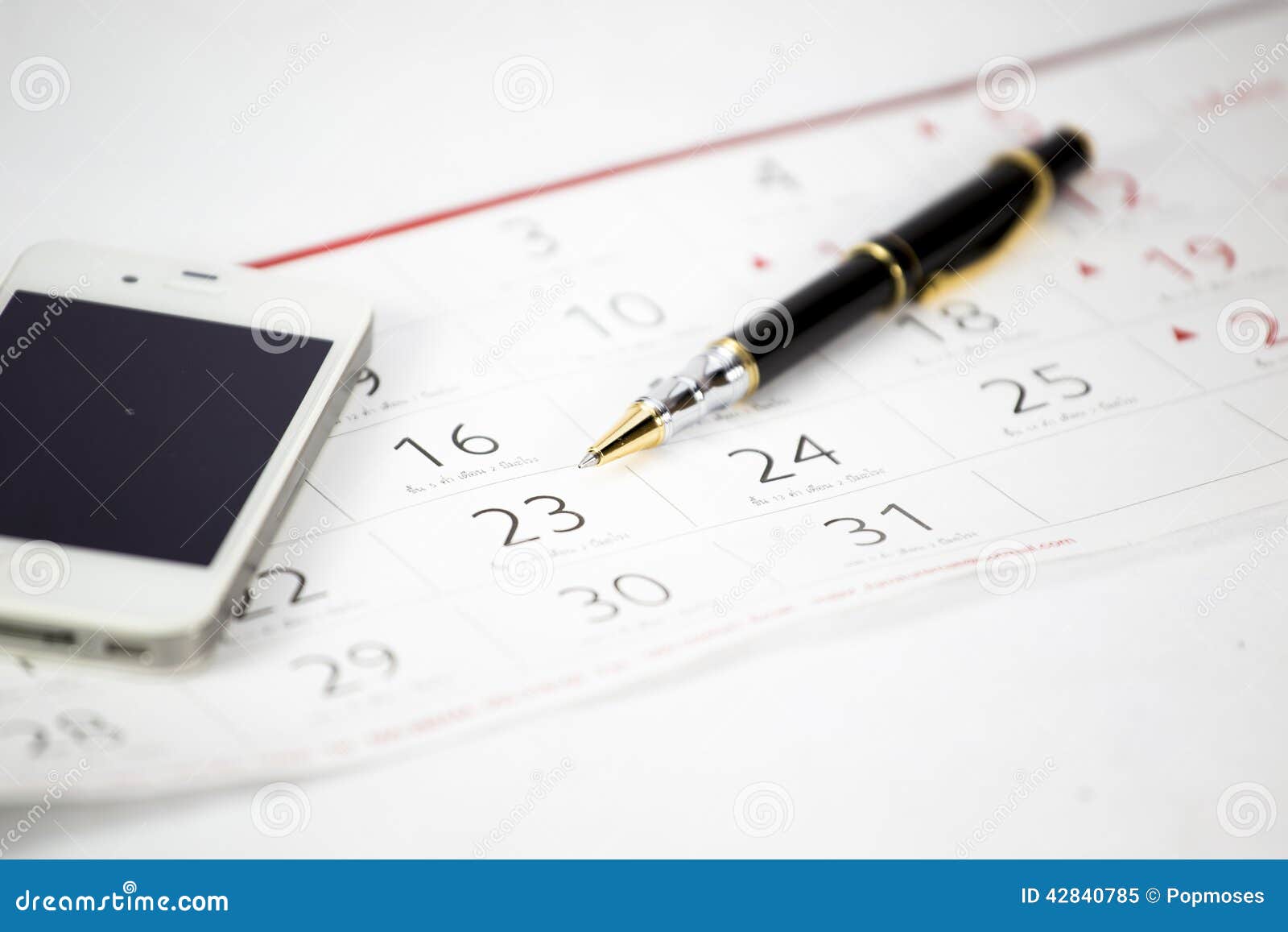 The pen put on calendar stock image. Image of blue, black 42840785