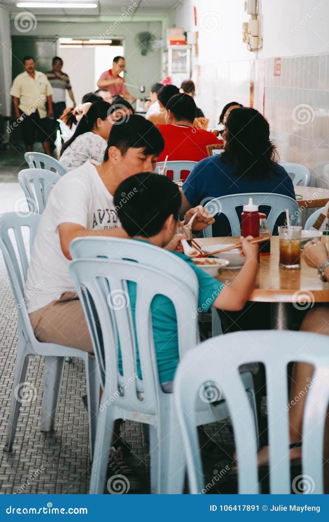 Family Eating Out at a Restaurant in Penang Editorial Photo - Image of