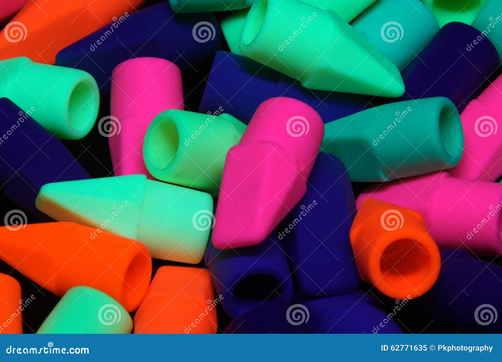 Pencil Erasers Under Black Light Stock Image Image of orange, bright