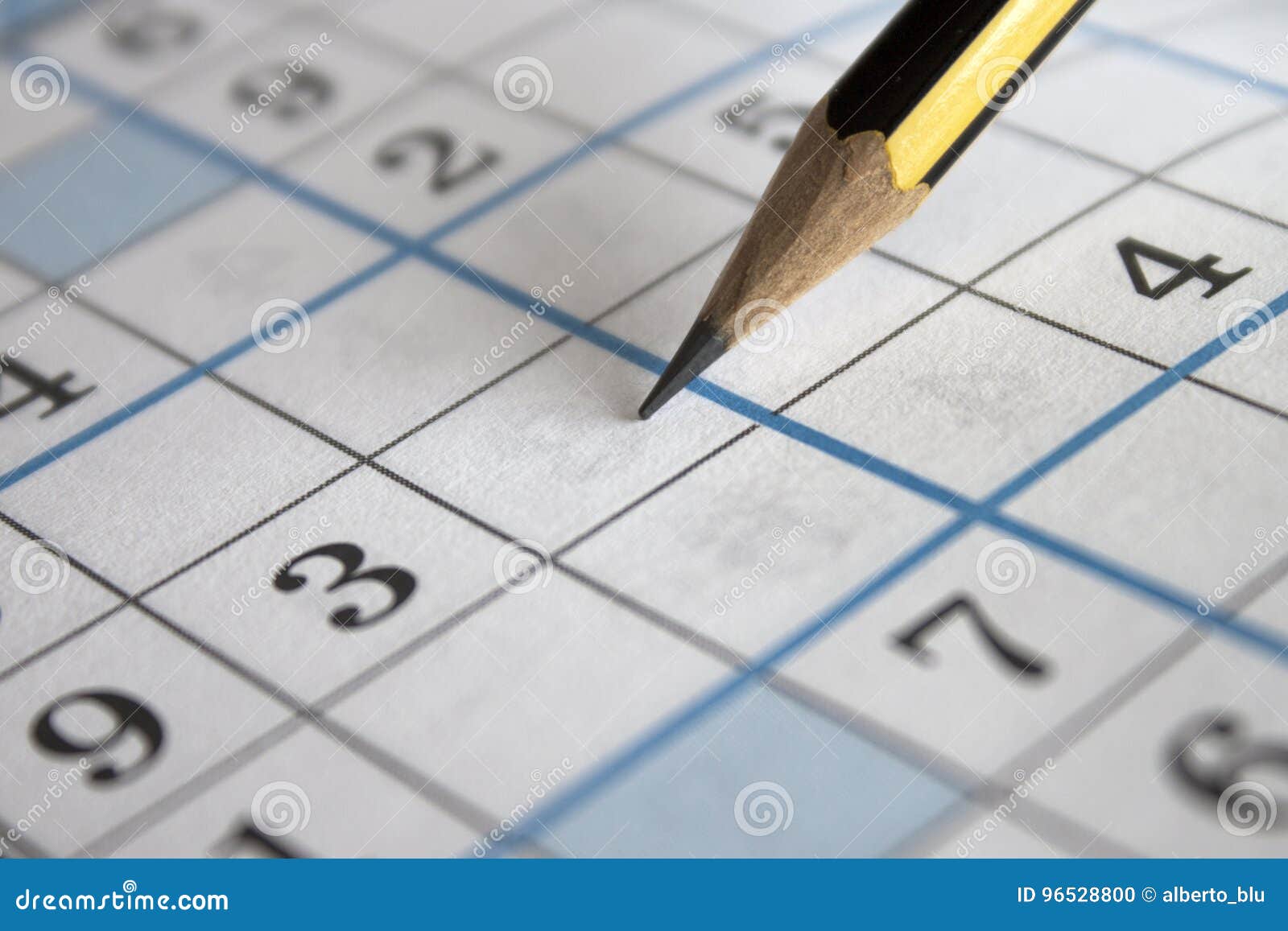 pencil on sudoku puzzle grid sheet