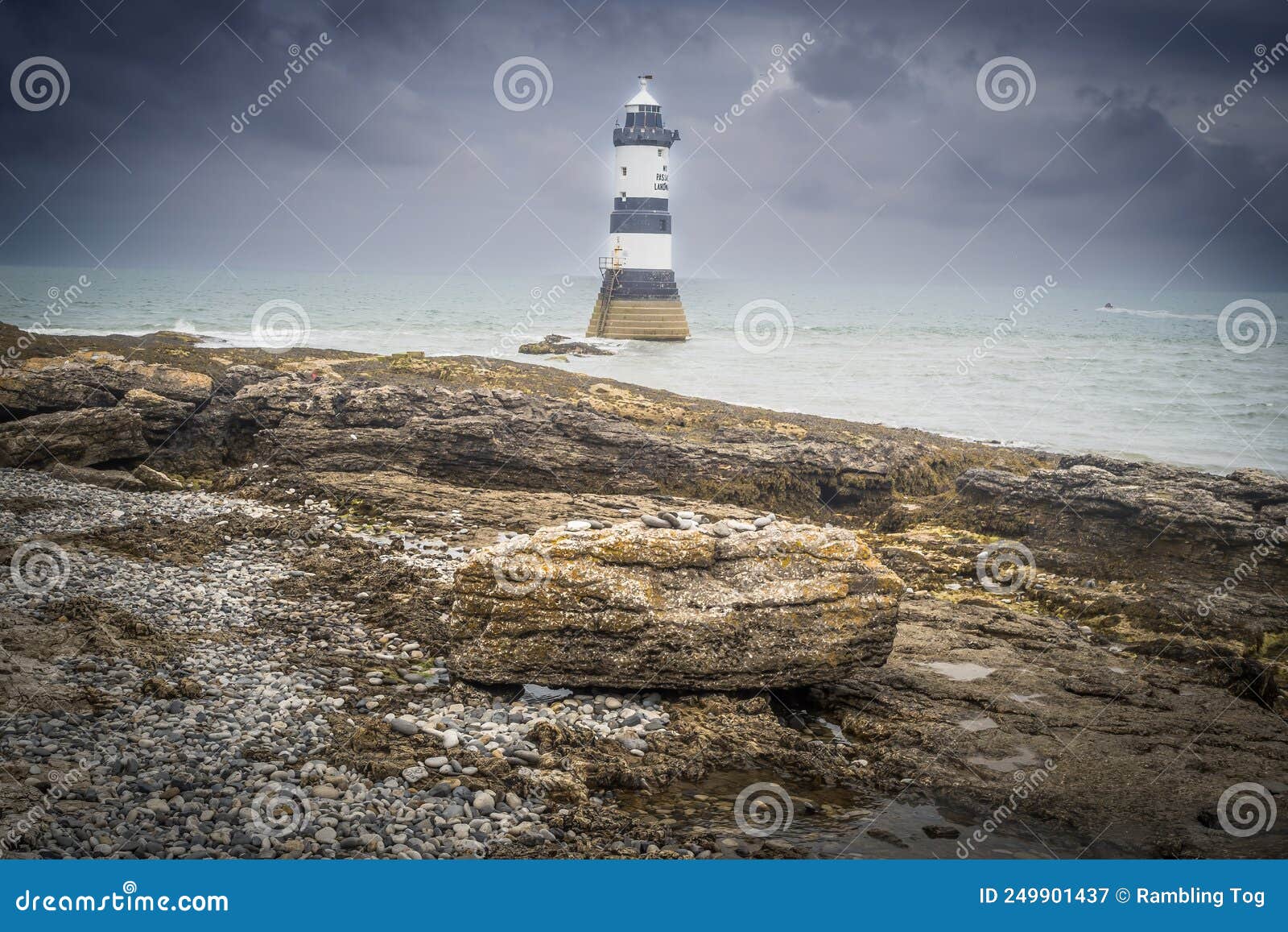 penmon lighthouse sits at the start of the menai strait across from puffin island