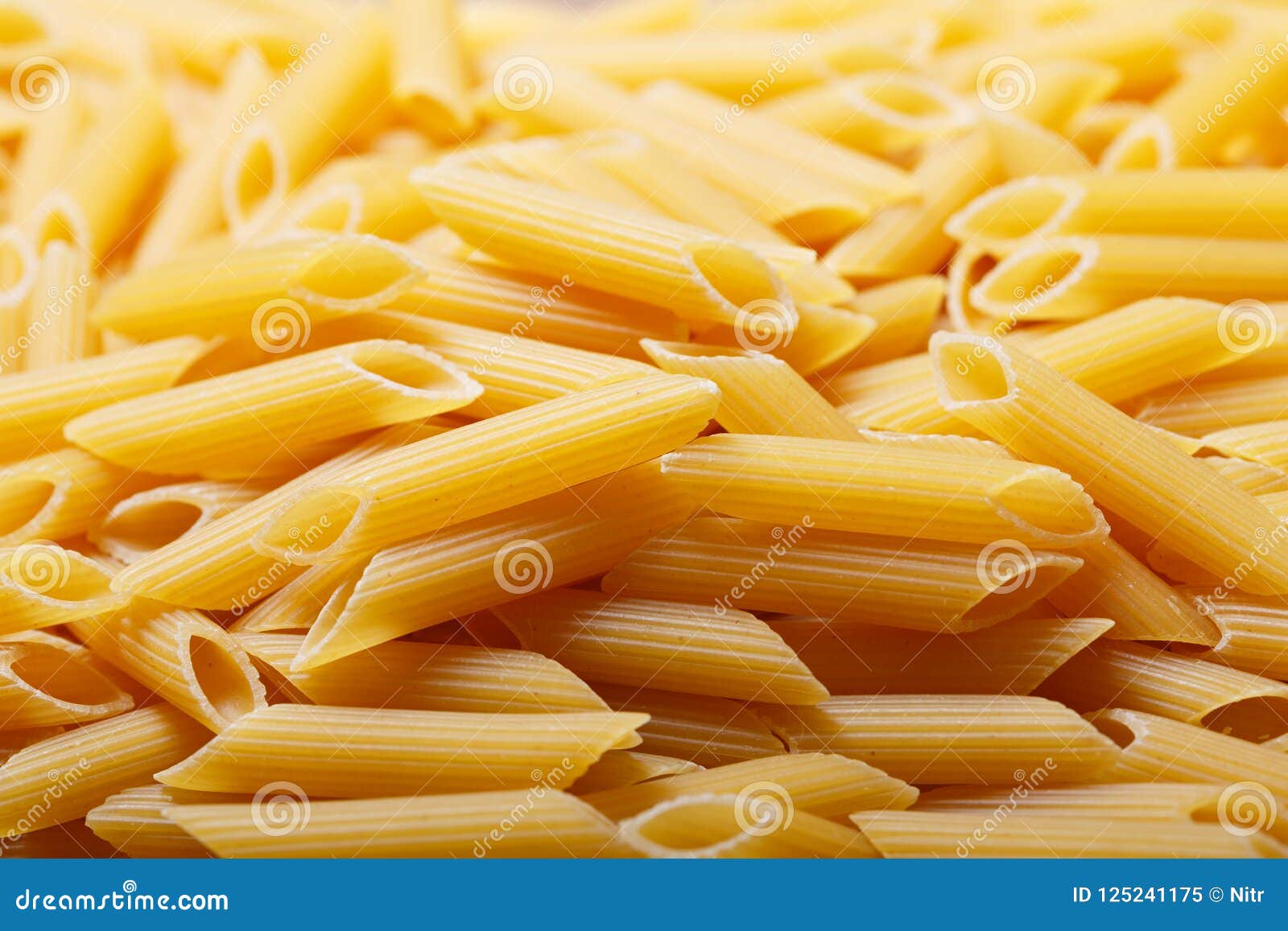 Penne pasta as background stock image. Image of penne 125241175