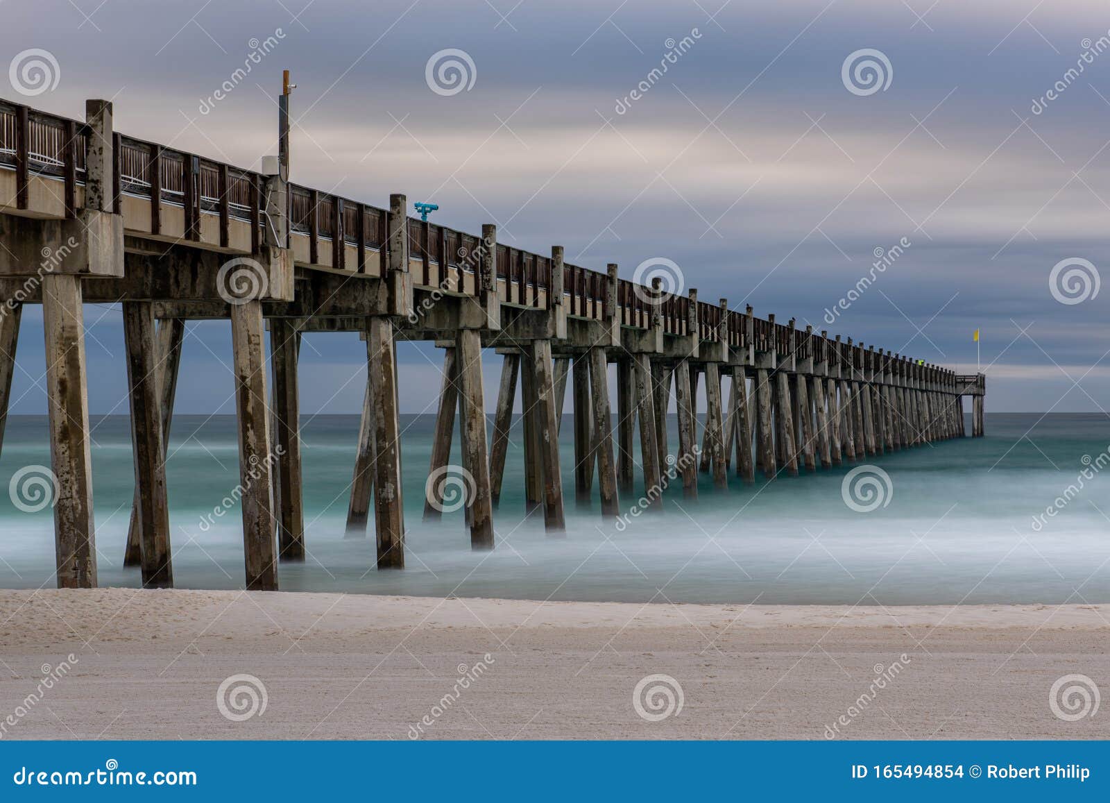 the pensacola beach pier in the morning looking out on the gulf of mexico