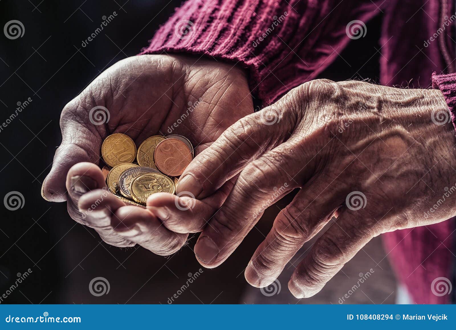 pensioner man holding in hands euro coins. theme of low pensions