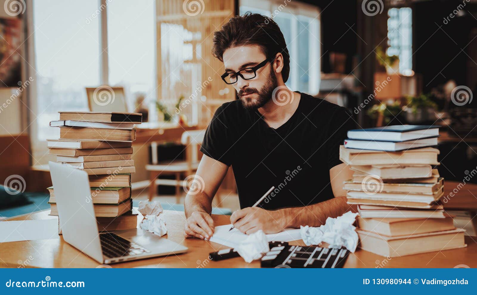 pensive freelance text writer working at desk