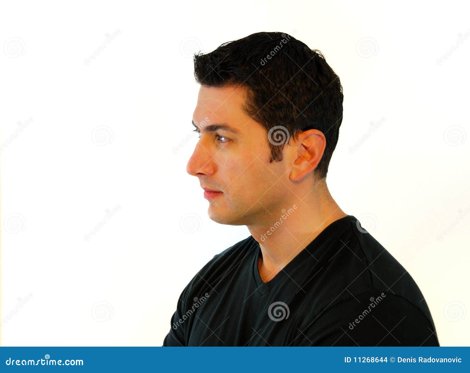 Profile view of sad young man looking down Stock Photo - Alamy