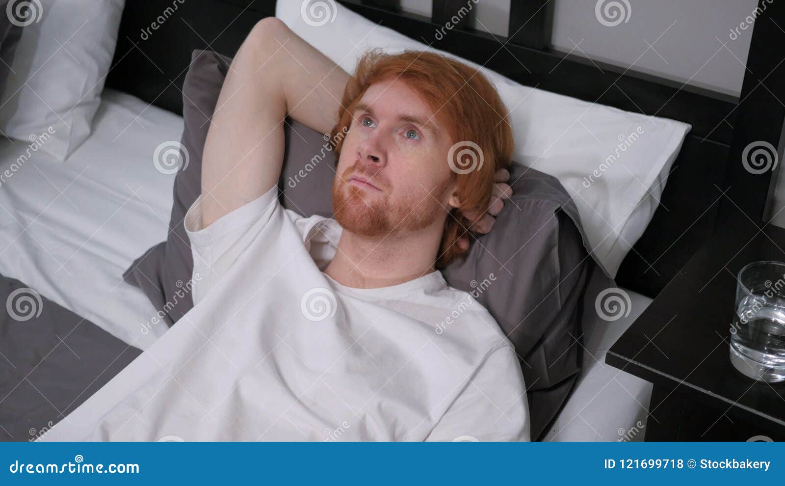 Pensive Redhead Man Lying in Bed for Rest, Thinking Stock Photo - Image ...