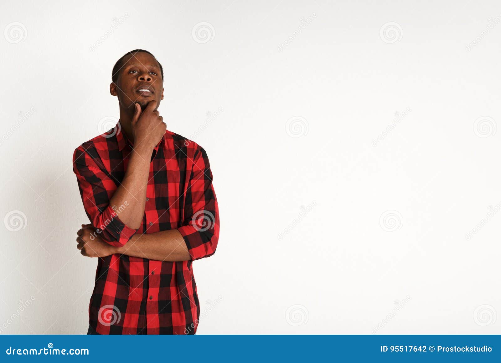 Pensive Young Black Man Portrait At Studio Background Stock Photo