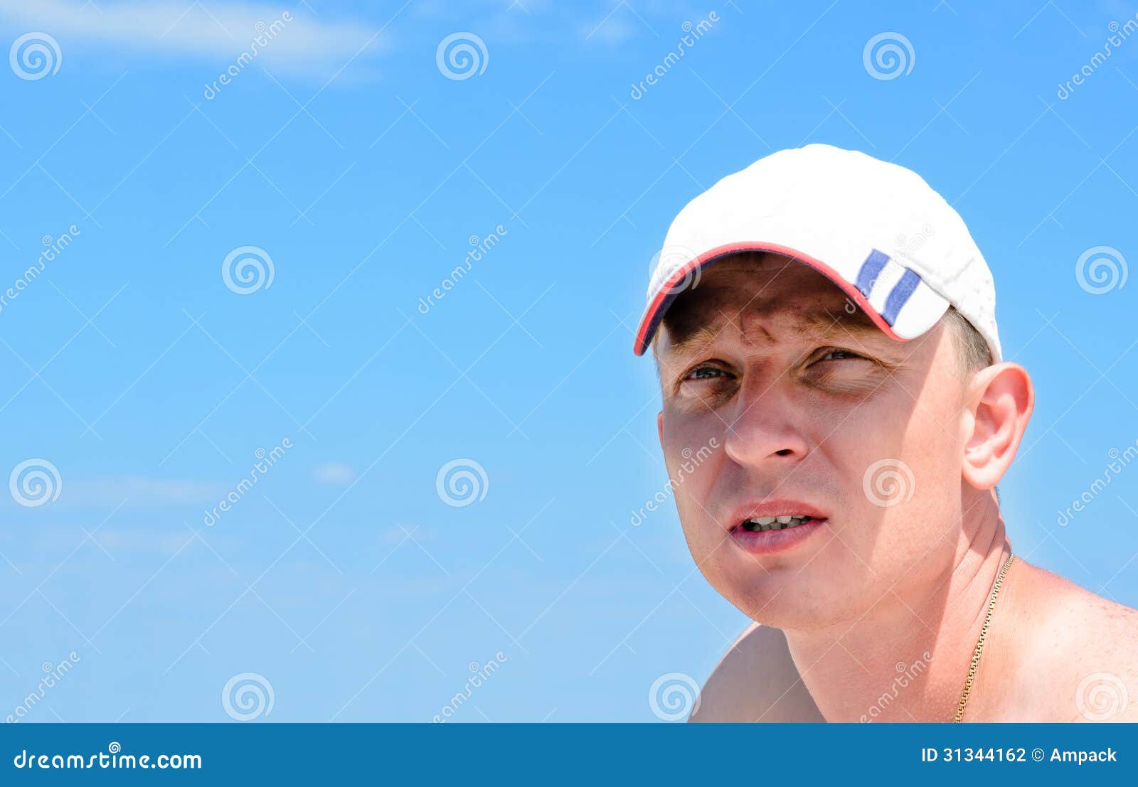 Pensive young man. Portrait of a young pensive man with cap