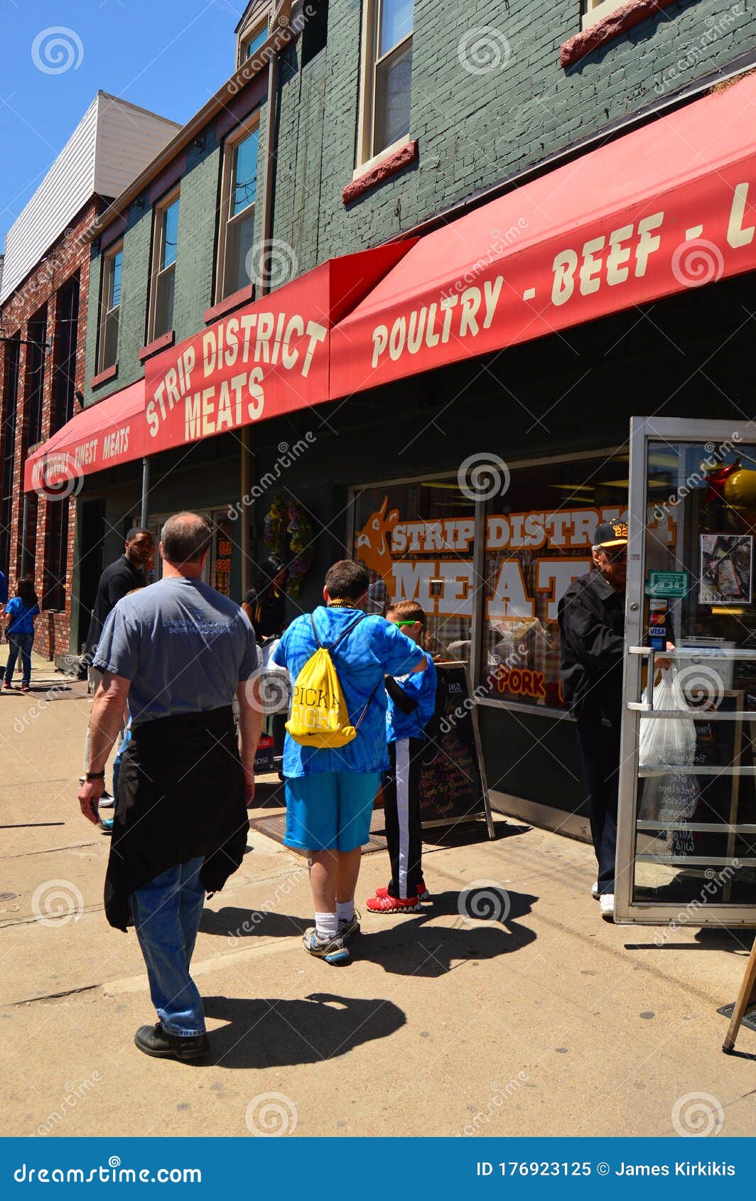 People Browse Along the Strip District in Pittsburgh Editorial Image