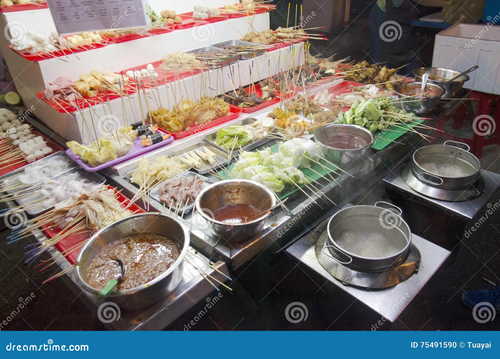 People Buy and Cook Lok Lok Food Malaysian Style at Restaurant Stock