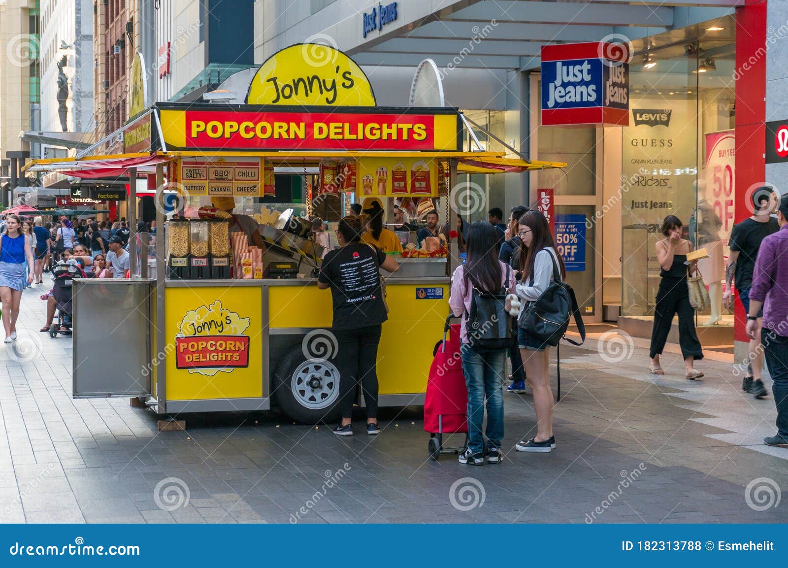 People Buying Snacks from Food Truck Selling Popcorn Editorial Stock