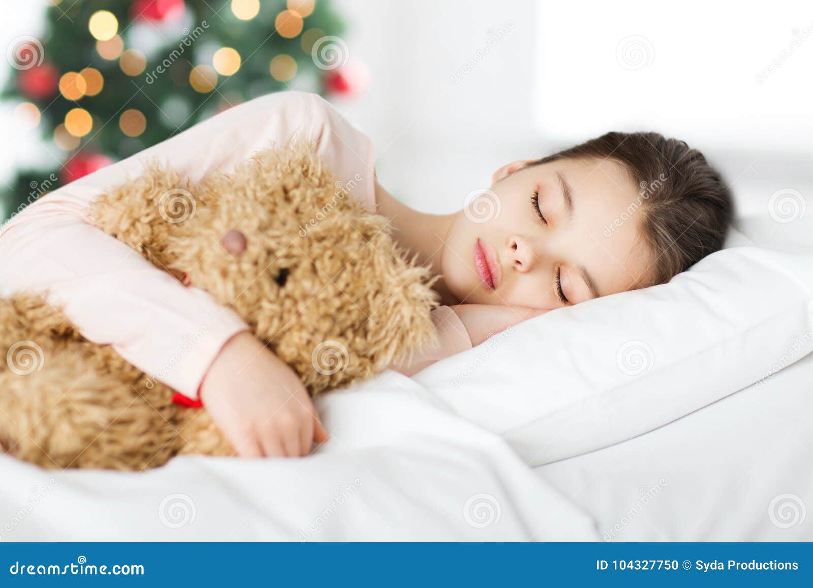 Girl Sleeping with Teddy Bear in Bed at Christmas Stock Photo ...