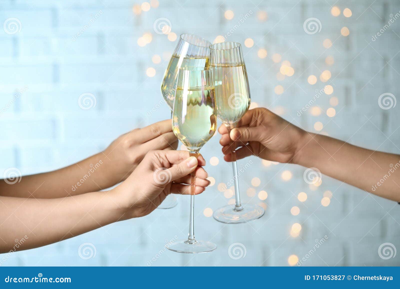 People Clinking Glasses Of Champagne Against Lights Closeup Stock Image Image Of Goblet